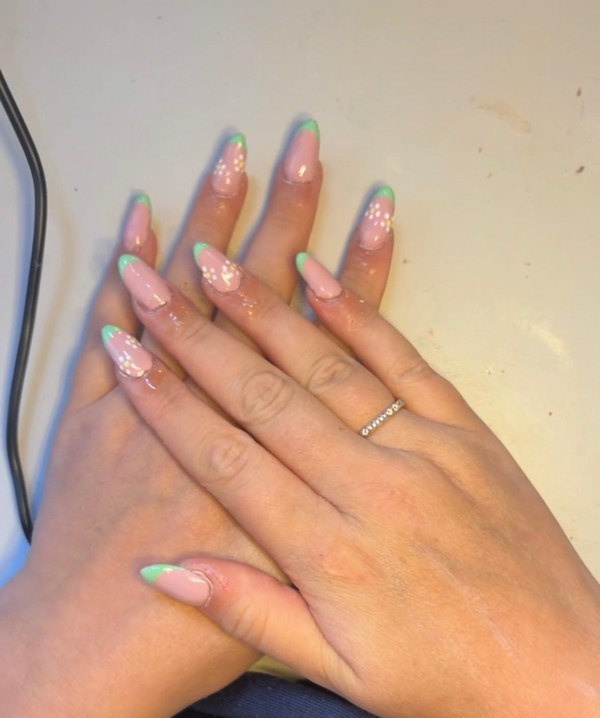 Nude almond nails with mint floral French tips